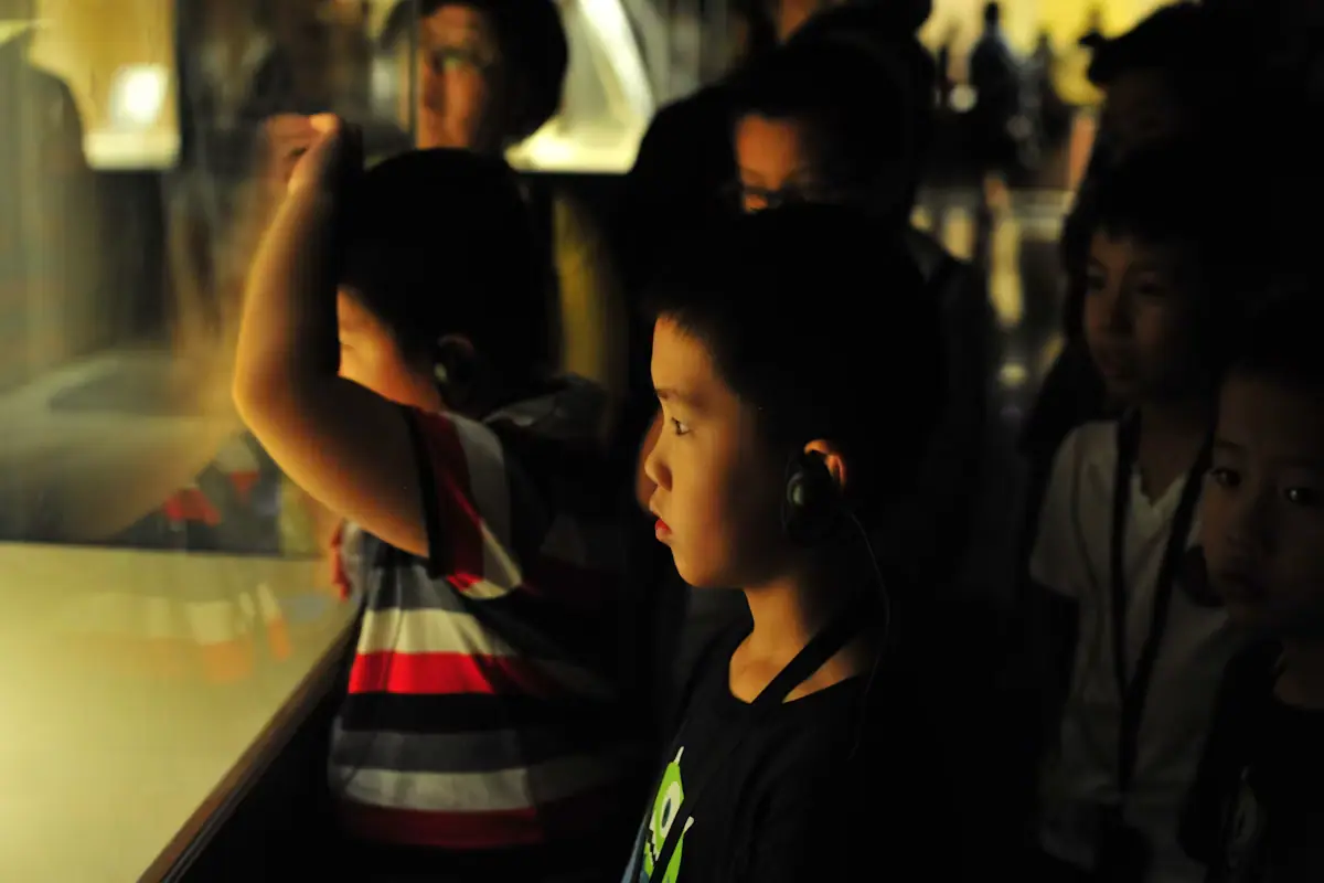 Children looking at a display case in a museum gallery