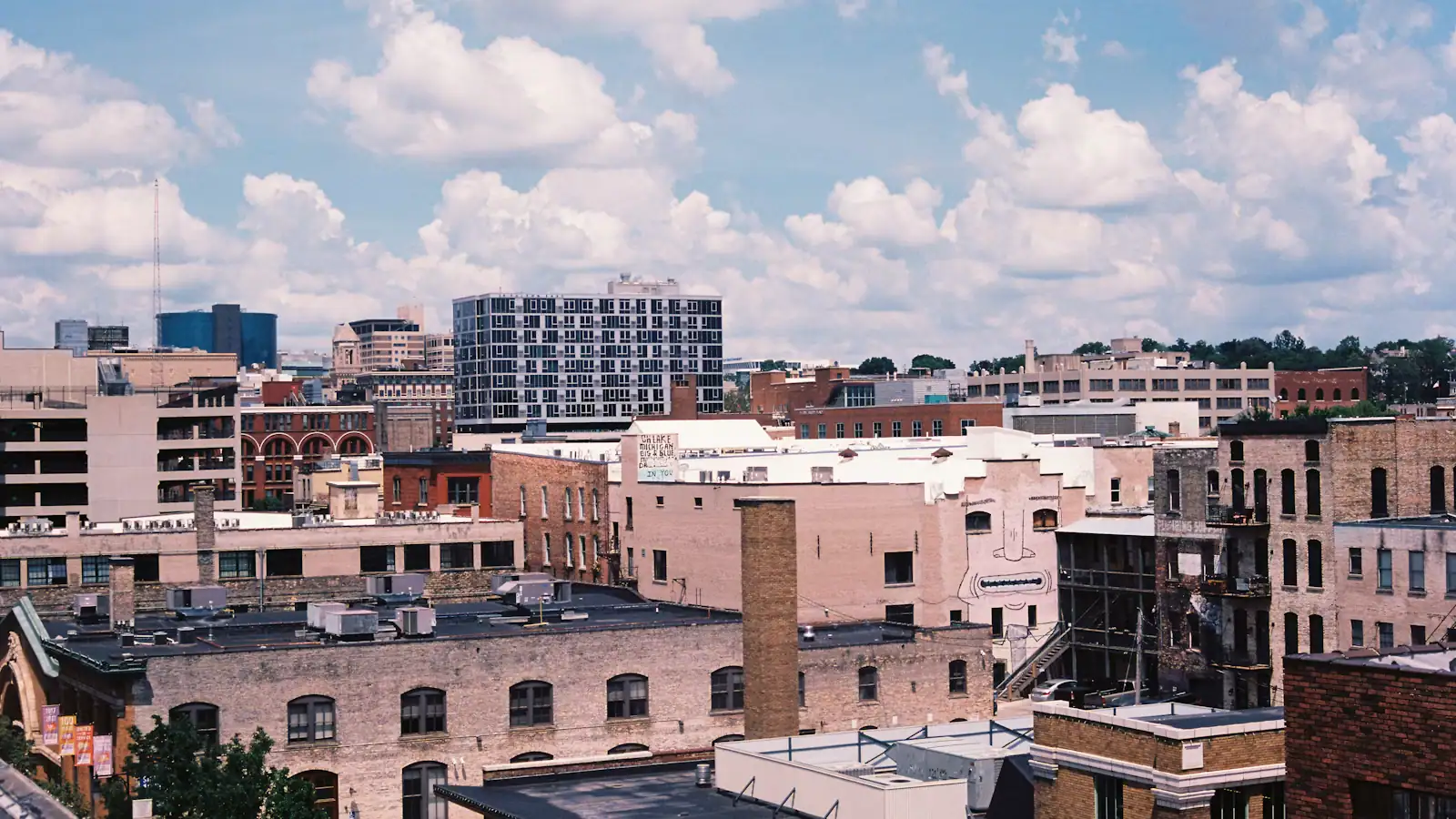 Downtown rooftops and older masonry buildings photographed from above on film